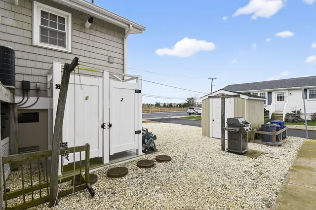 an aerial view of residential houses with outdoor space