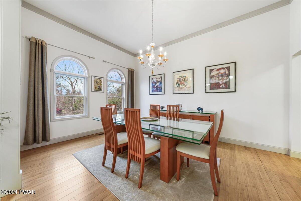 212 Rodeo Drive Hawley, PA 18428 - Photo 4 of 79 a view of a dining room with furniture window and wooden floor