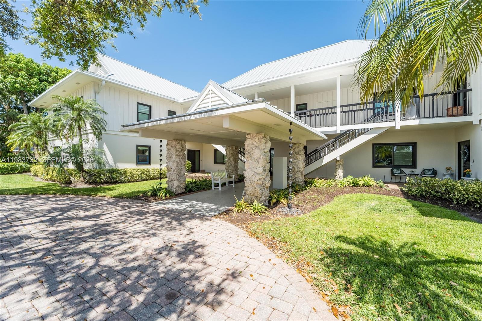 851 Saturn Street, Unit D Jupiter, FL 33477 - Photo 3 of 60 a view of a house with a yard