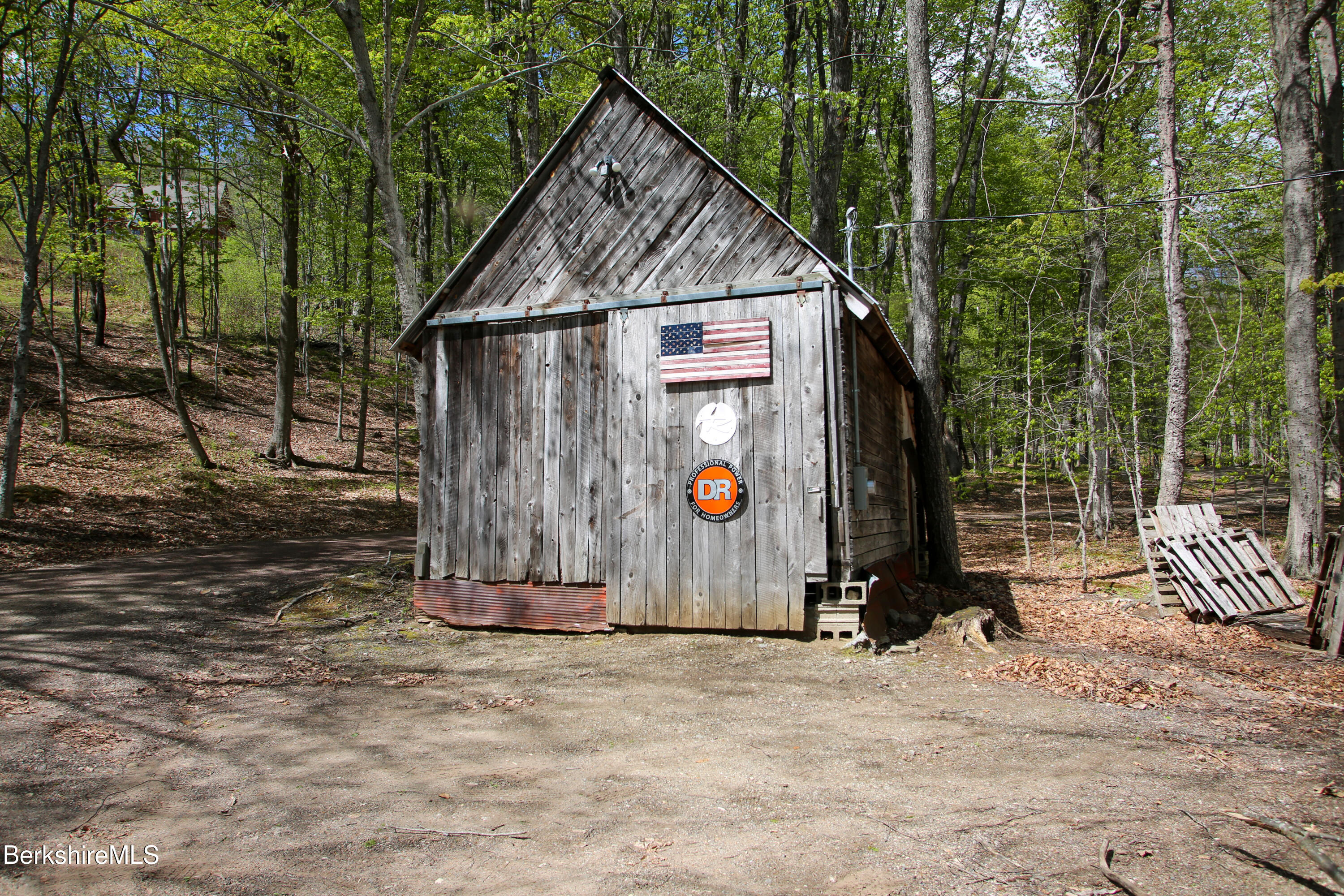 421 Legate Hill Road Charlemont, MA 01339 - Photo 36 of 37 a view of a wooden house with large trees