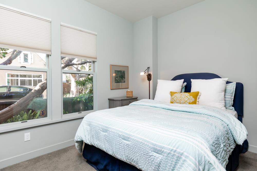 209 Fanmar Way Capitola, CA 95010 - Photo 15 of 31 a bedroom with a large bed and a window