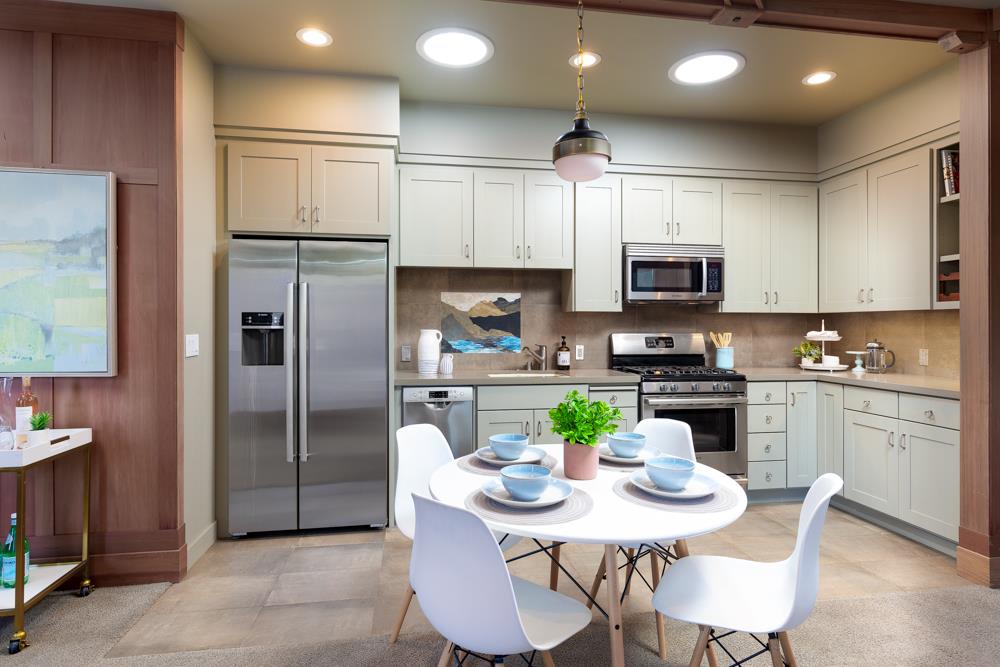209 Fanmar Way Capitola, CA 95010 - Photo 5 of 31 a kitchen with a refrigerator a stove a microwave a dining table and chairs