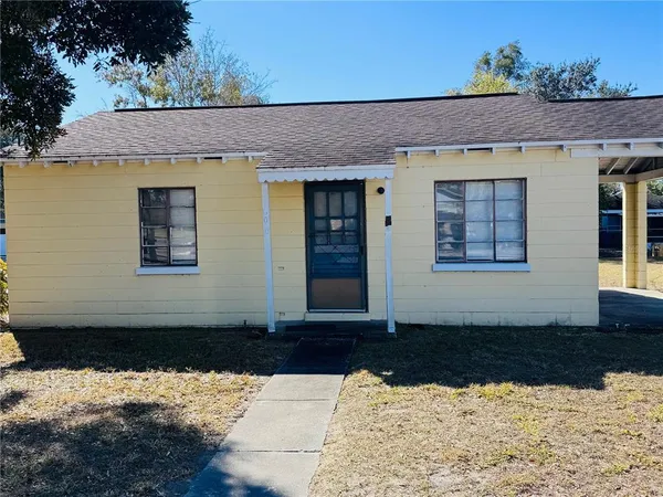 a view of house with yard