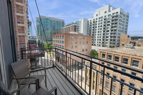 a view of balcony with a bench