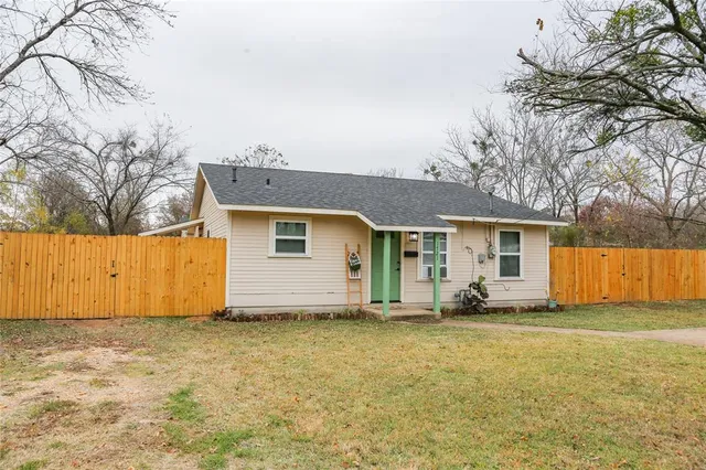 a house with trees in front of it
