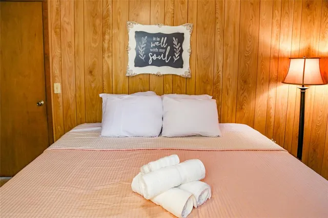 a bathroom with a bathtub and a shower curtain