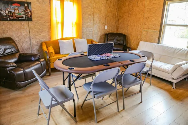 a view of an entryway with wooden floor