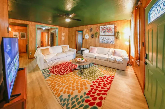 a living room with furniture and a rug