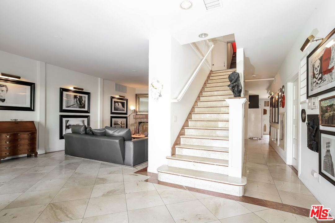 1643 Buckingham Road Los Angeles, CA 90019 - Photo 2 of 26 a view of a living room with furniture and stairs