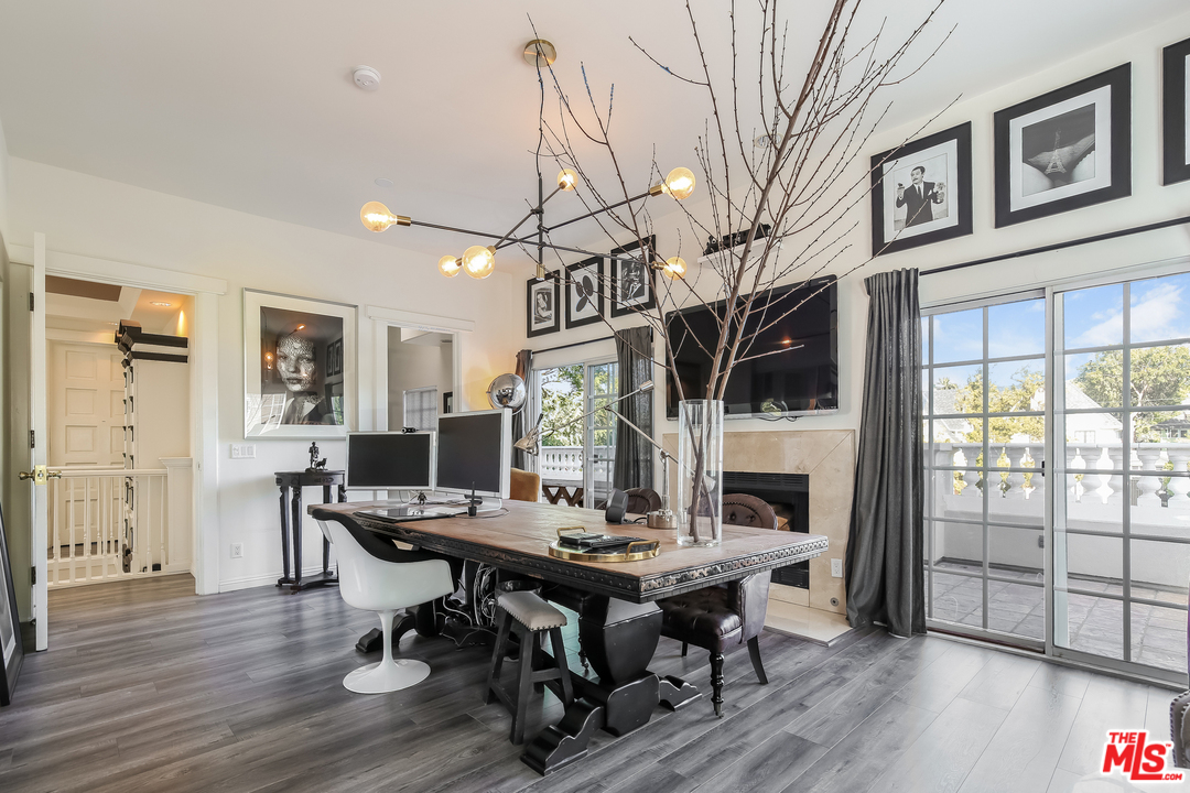 1643 Buckingham Road Los Angeles, CA 90019 - Photo 15 of 26 a view of a dining room with furniture window and wooden floor