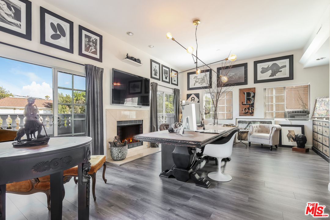1643 Buckingham Road Los Angeles, CA 90019 - Photo 16 of 26 a view of a dining room with furniture window and wooden floor