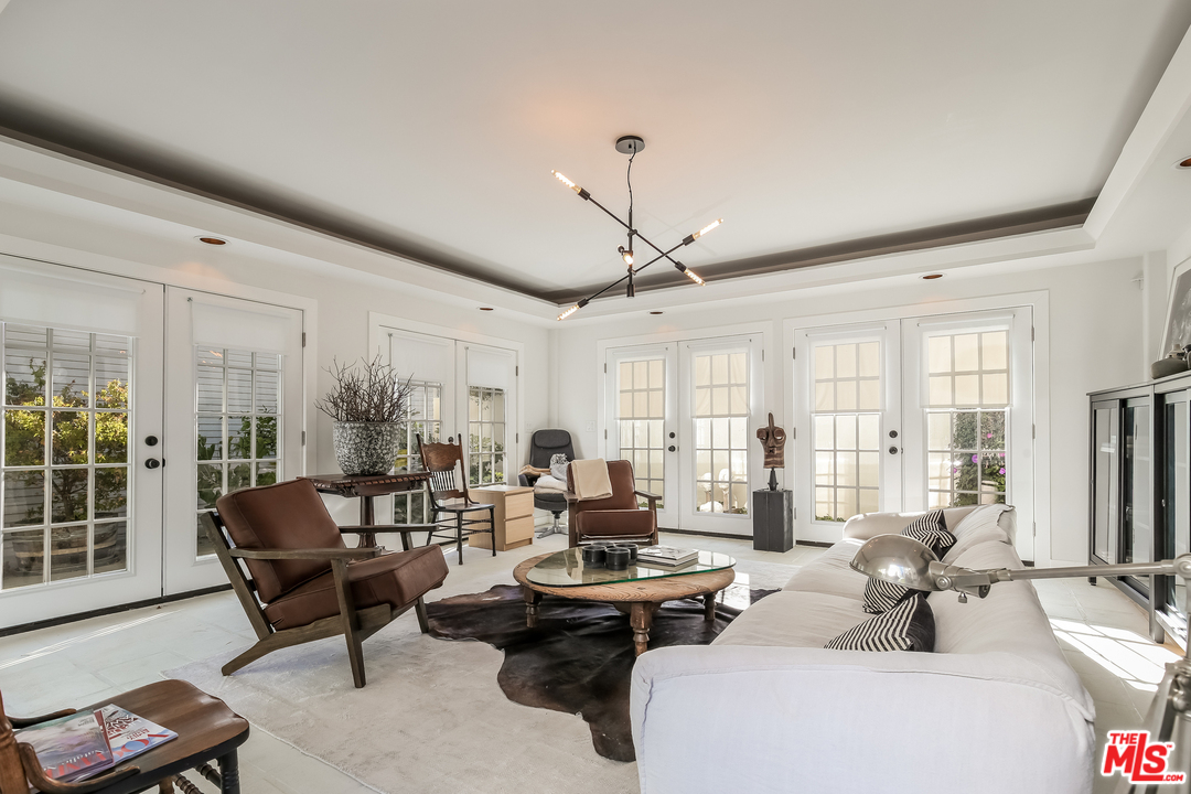 1643 Buckingham Road Los Angeles, CA 90019 - Photo 21 of 26 a living room with furniture and large windows