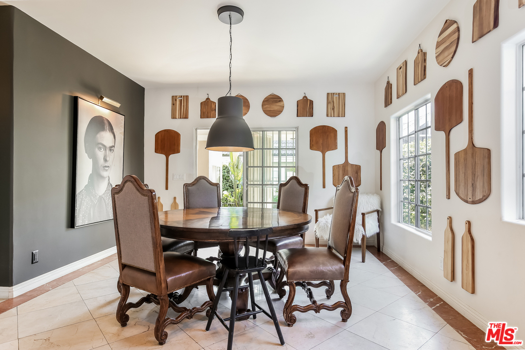 1643 Buckingham Road Los Angeles, CA 90019 - Photo 4 of 26 a view of a dining room with furniture and chandelier