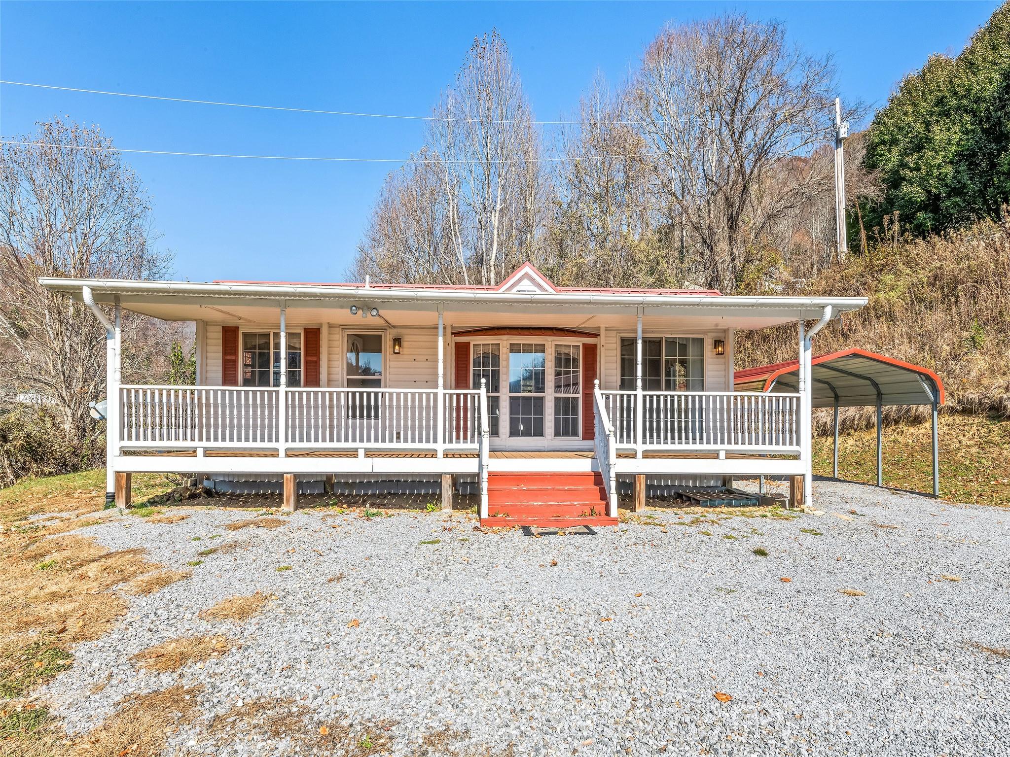 93 Merry Way Clyde, NC 28721 - Photo 3 of 24 front view of a house with a yard