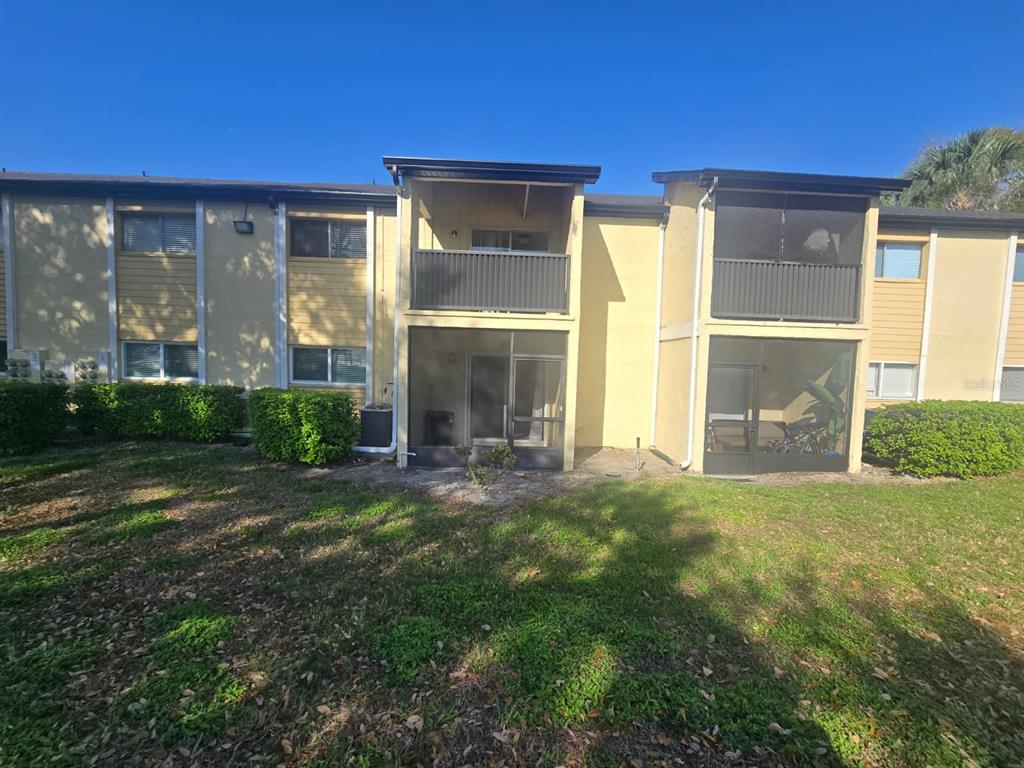 902 Lake Destiny Road, Unit C Altamonte Springs, FL 32714 - Photo 15 of 23 a view of a house with backyard and porch
