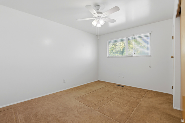 2348 North 770 West Clinton, UT 84015 - Photo 8 of 25 Carpeted room with a ceiling fan light fixture, a window with horizontal blinds, and white painted walls