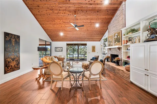 a dining room with furniture window and wooden floor