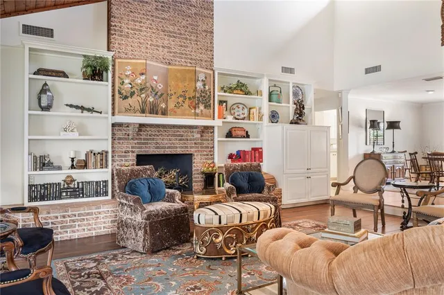 a kitchen with stainless steel appliances granite countertop a refrigerator a stove and a sink