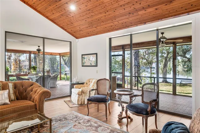 a kitchen with stainless steel appliances granite countertop a sink refrigerator and cabinets