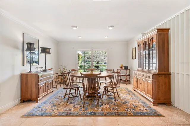 a view of a dining room with furniture large windows and wooden floor