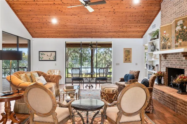 a dining room with furniture water view and balcony