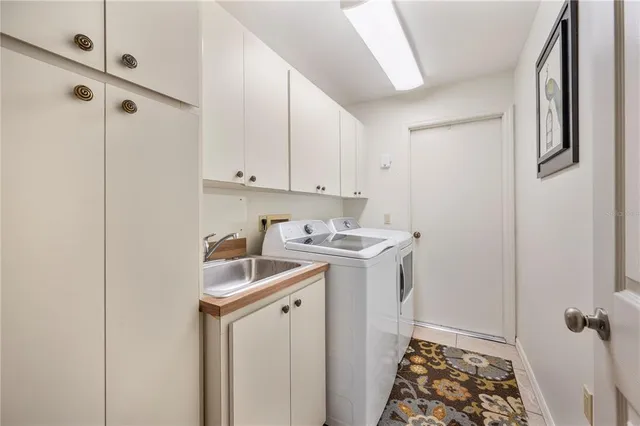 a en suite bathroom with a granite countertop sink and a mirror