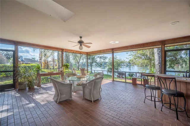 a view of deck and patio with wooden floor and fence