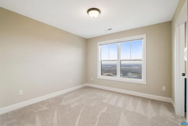 a bathroom with a toilet and shower