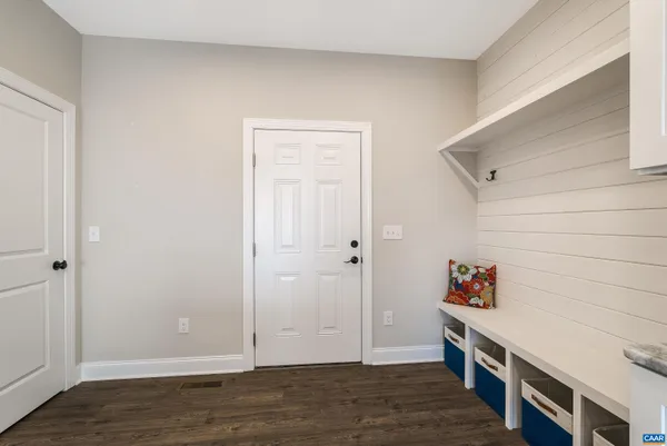 a front view of house with yard and flowers