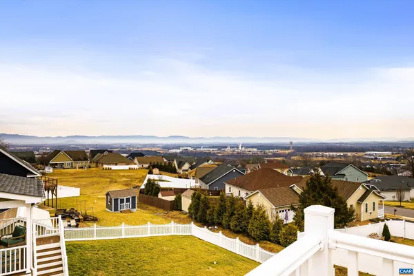 a view of city and mountain from a balcony