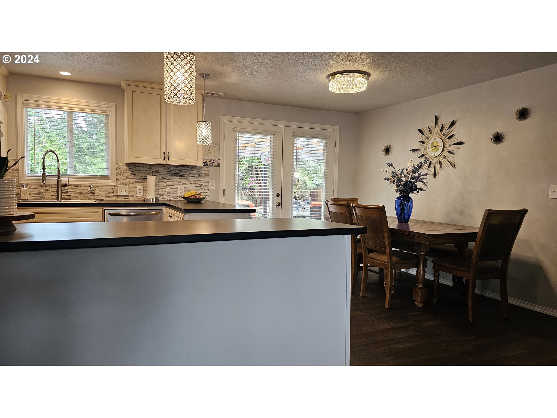 2168 15th Street Springfield, OR 97477 - Photo 7 of 43 a kitchen with a table and chairs in it