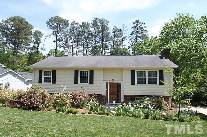905 Tyrrell Road Raleigh, NC 27609 - Photo 1 of 13 a front view of a house with a yard