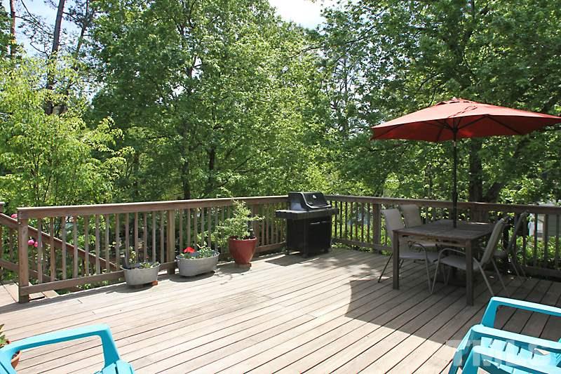 905 Tyrrell Road Raleigh, NC 27609 - Photo 10 of 13 a view of a deck with furniture and wooden floor