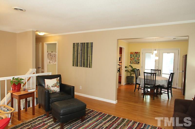 905 Tyrrell Road Raleigh, NC 27609 - Photo 3 of 13 a living room with furniture and wooden floor