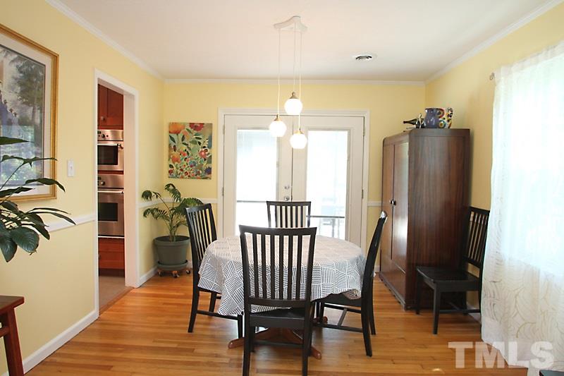905 Tyrrell Road Raleigh, NC 27609 - Photo 4 of 13 a view of a hallway with furniture and a livingroom