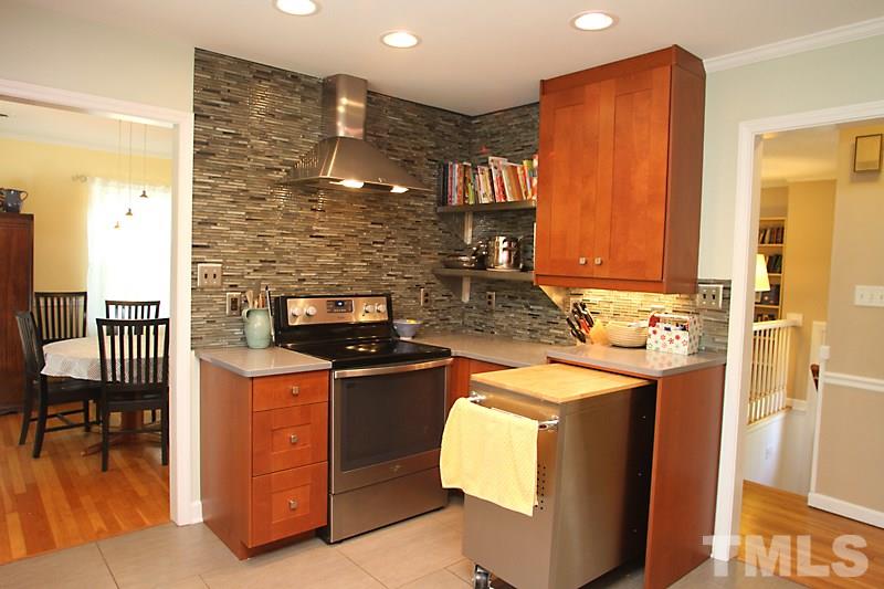 905 Tyrrell Road Raleigh, NC 27609 - Photo 6 of 13 a kitchen with a stove and a sink