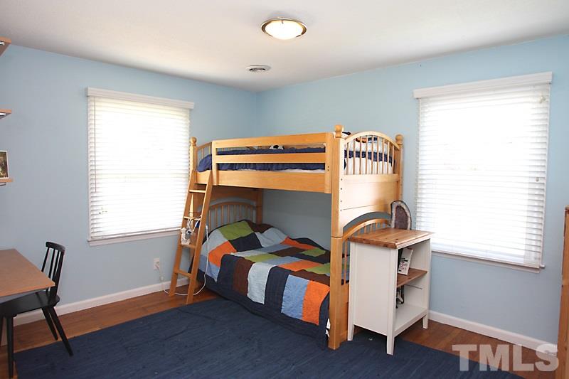 905 Tyrrell Road Raleigh, NC 27609 - Photo 7 of 13 a bedroom with furniture and a window