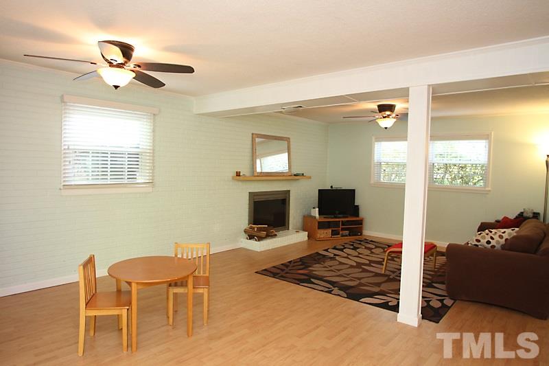 905 Tyrrell Road Raleigh, NC 27609 - Photo 13 of 13 a view of a livingroom with furniture and a fireplace