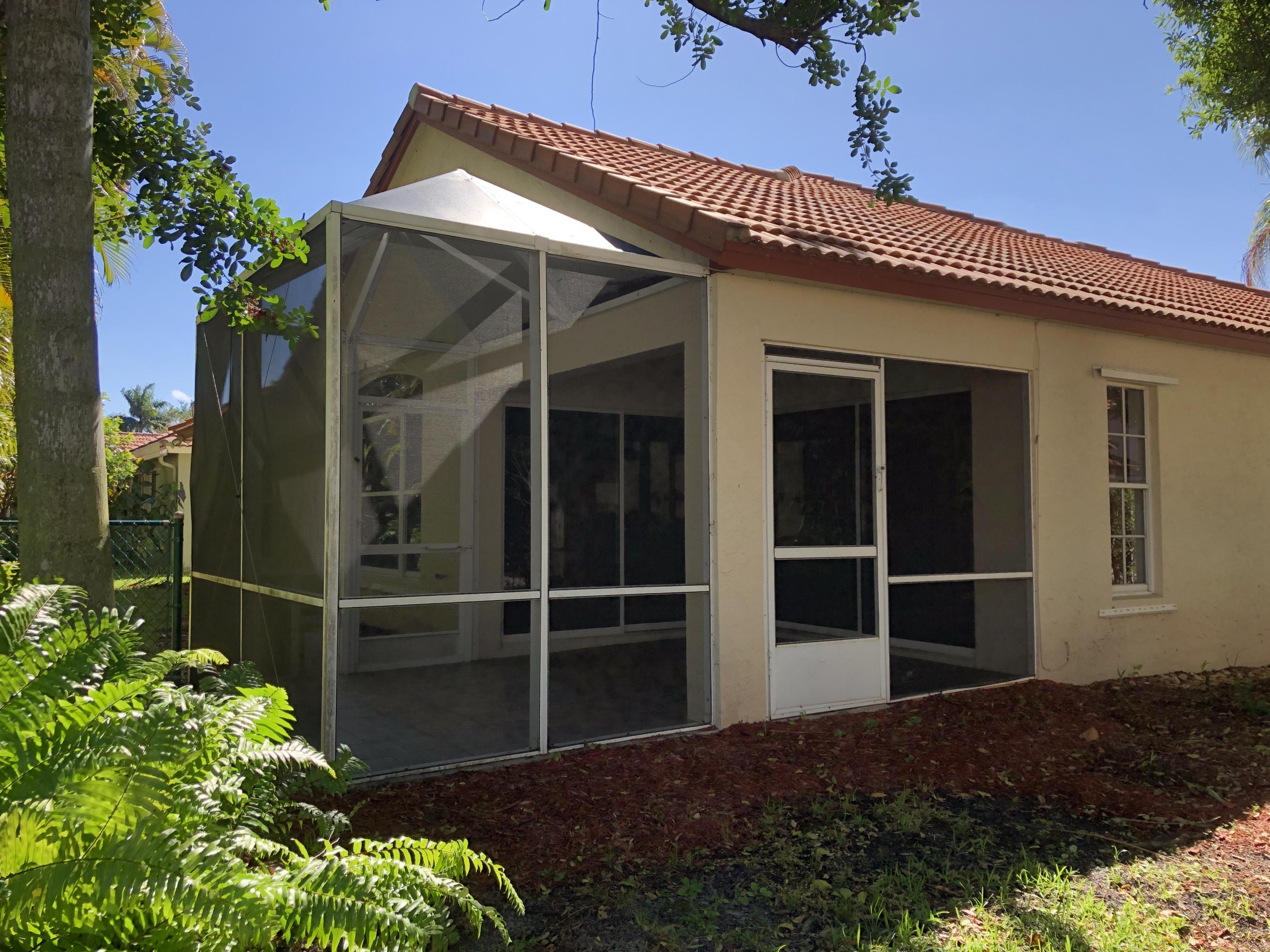 3121 Contego Lane Riviera Beach, FL 33418 - Photo 3 of 20 screened in patio
