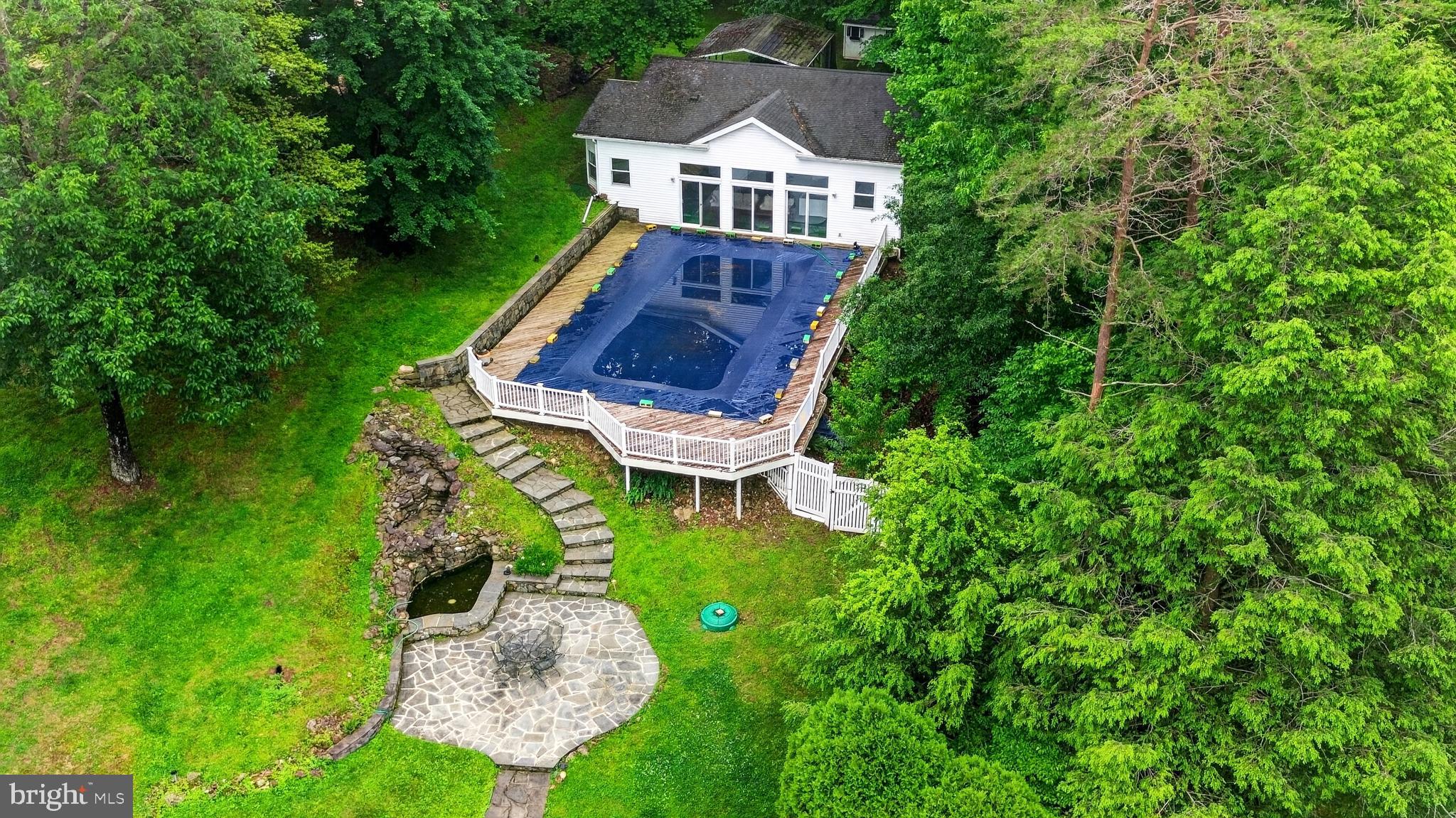 10320 Glen Road Potomac, MD 20854 - Photo 71 of 75 a aerial view of a house with a yard table and chairs