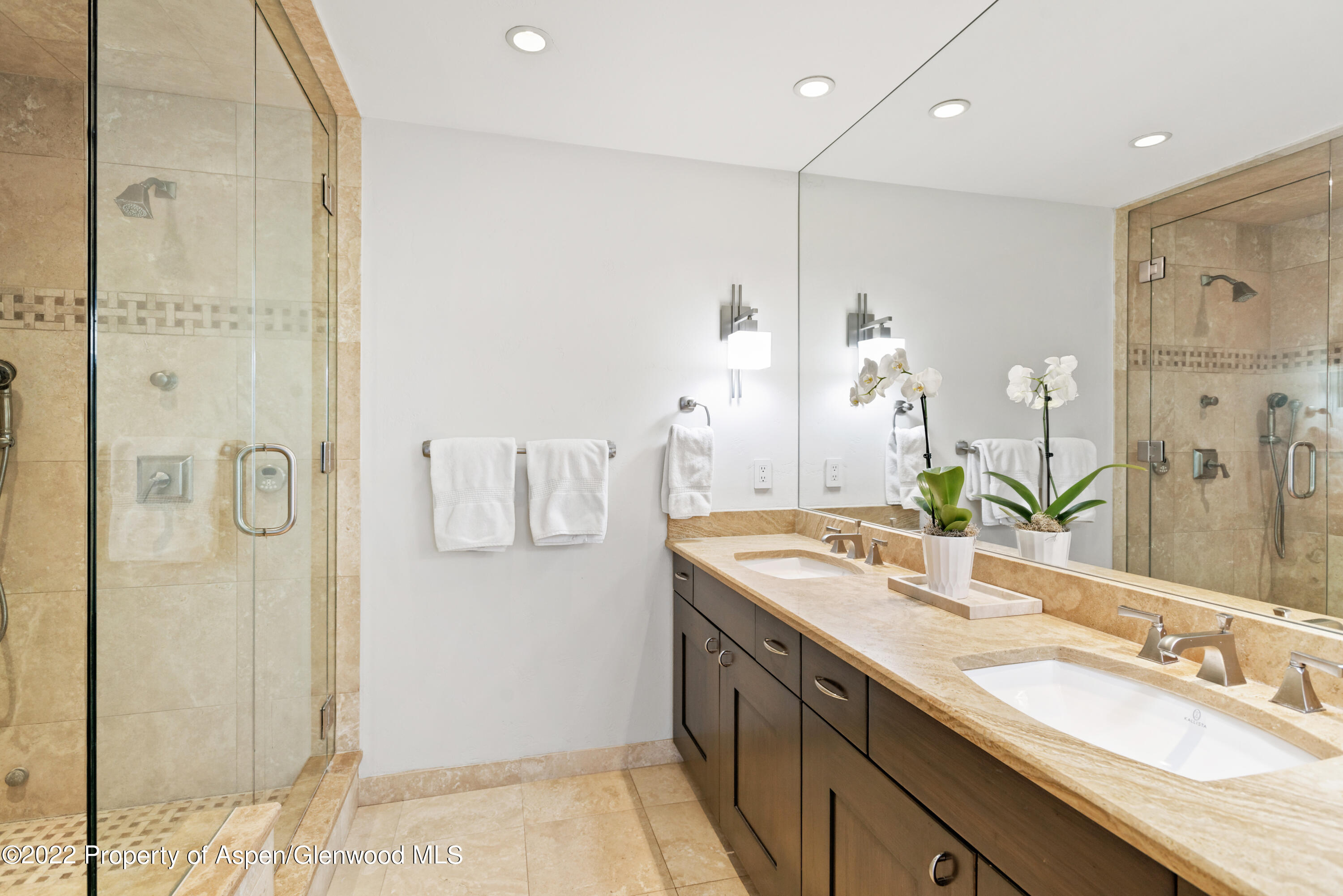 100 North 8th Street, Unit 20 Aspen, CO 81611 - Photo 11 of 18 a bathroom with a granite countertop shower sink and mirror