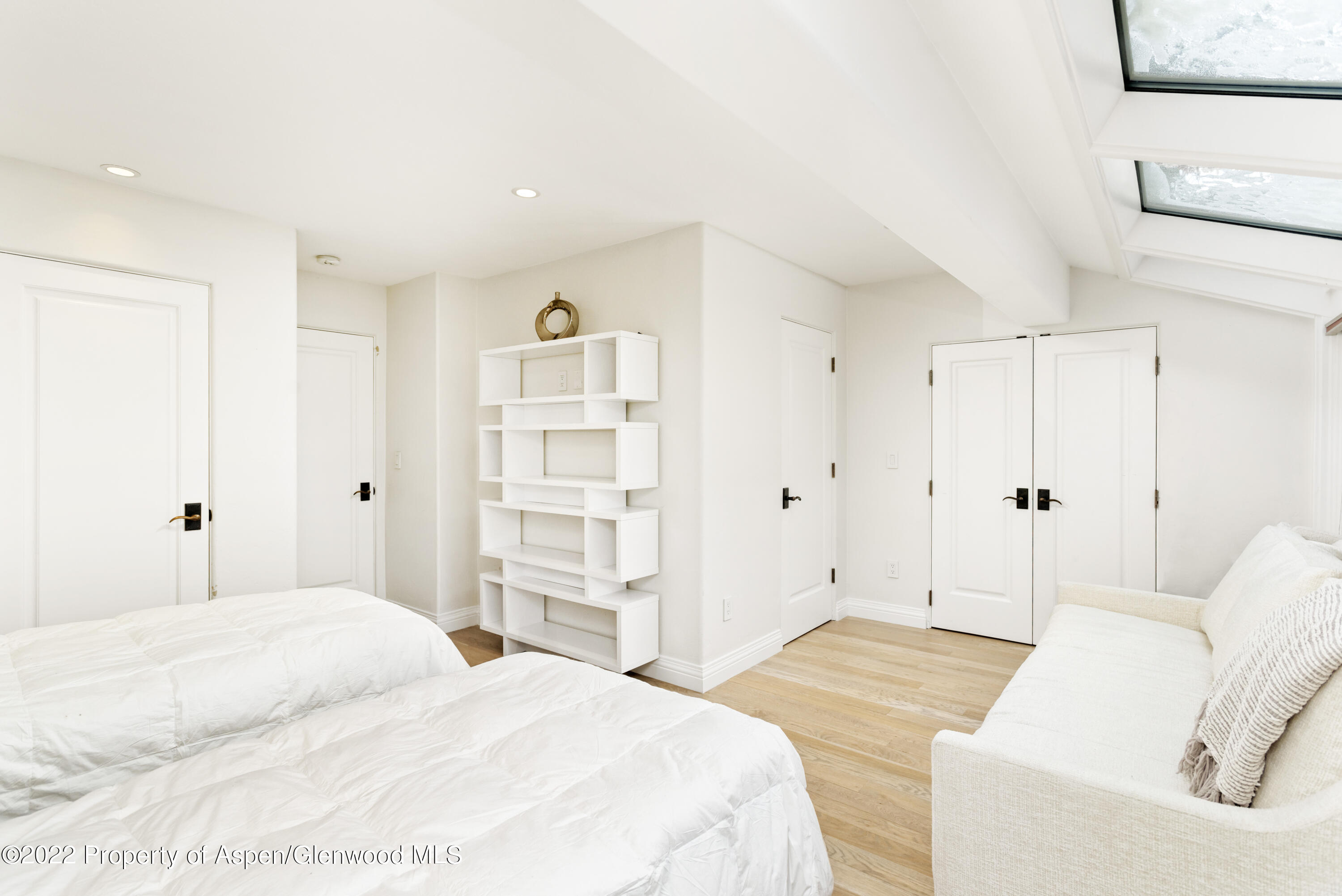 100 North 8th Street, Unit 20 Aspen, CO 81611 - Photo 12 of 18 a bedroom with a bed and a cabinets