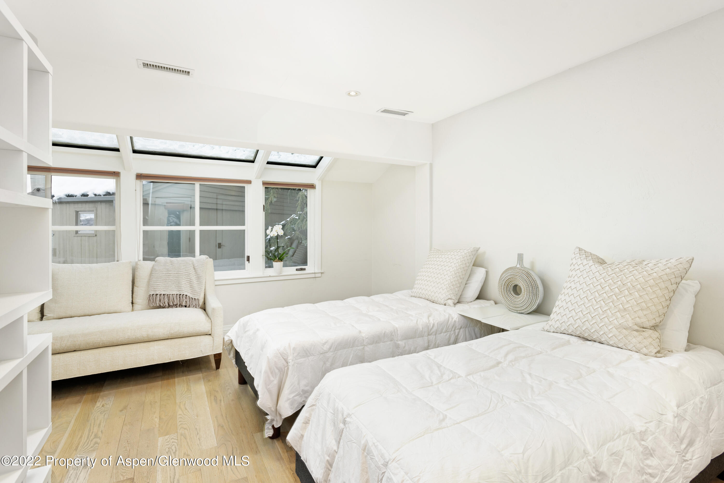 100 North 8th Street, Unit 20 Aspen, CO 81611 - Photo 13 of 18 a bedroom with two beds and a large window