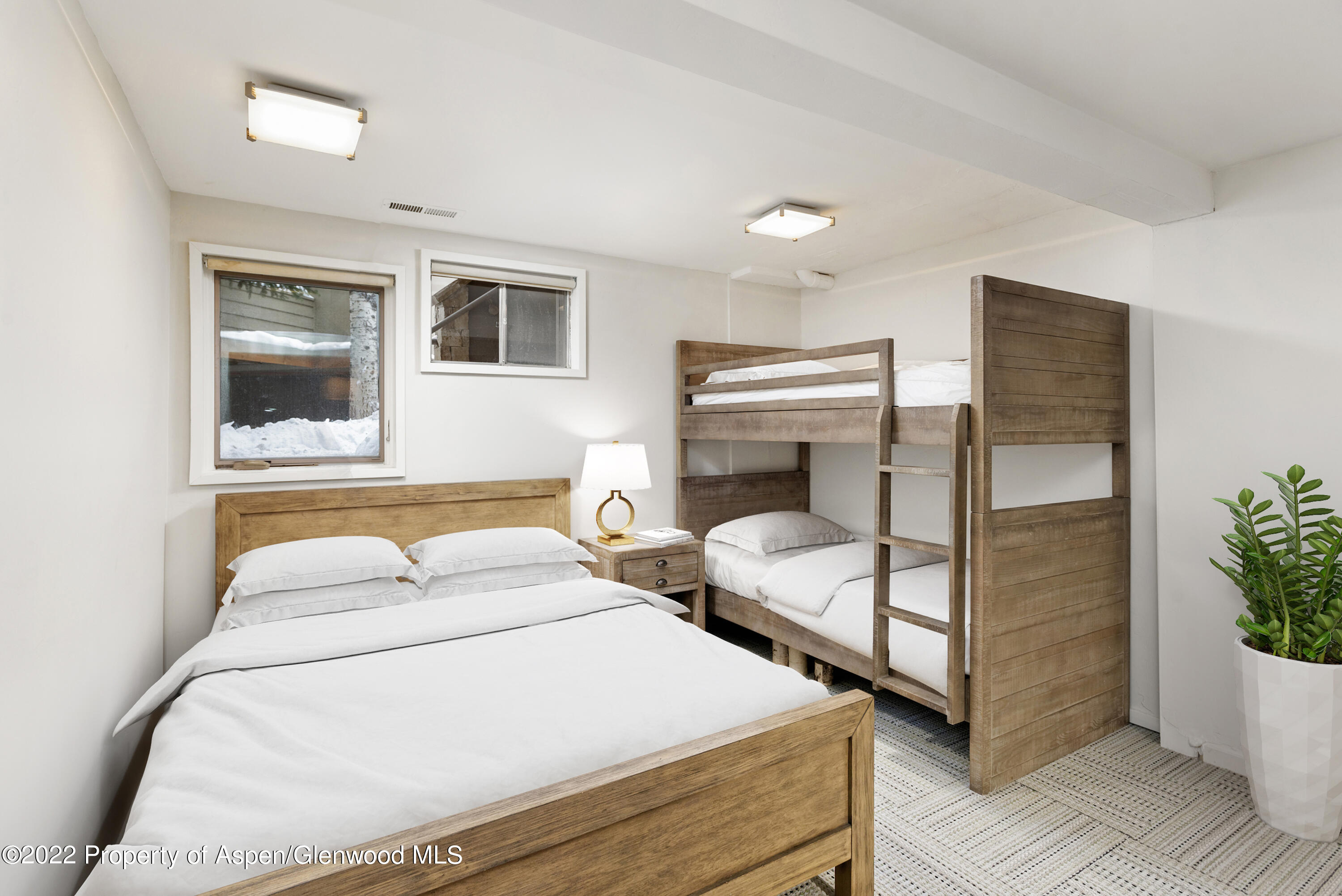 100 North 8th Street, Unit 20 Aspen, CO 81611 - Photo 16 of 18 a bedroom with two beds and potted plant