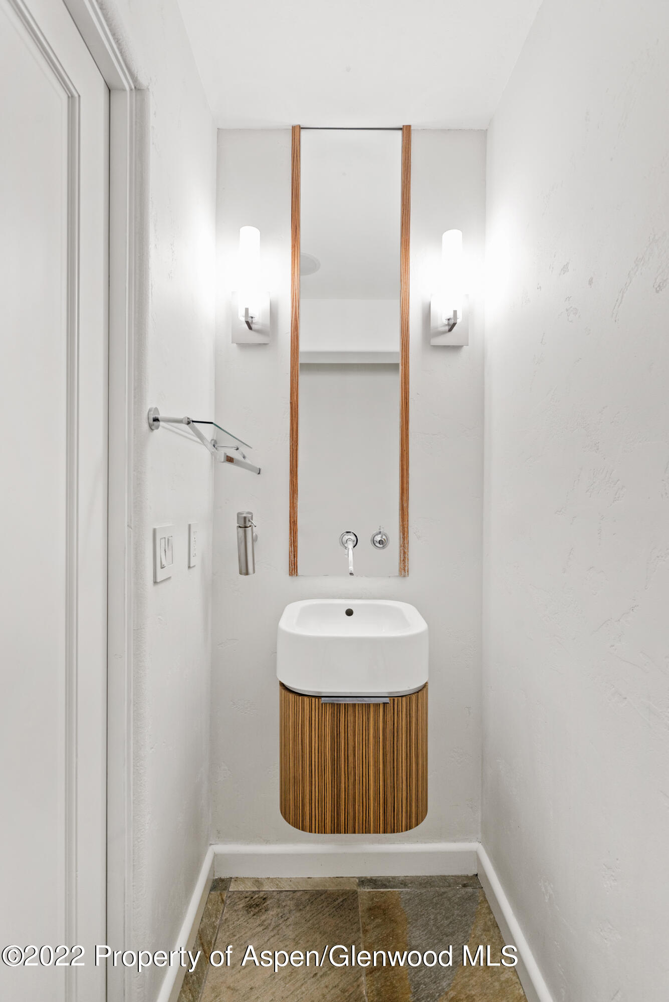 100 North 8th Street, Unit 20 Aspen, CO 81611 - Photo 8 of 18 a bathroom with a sink a mirror and a shower