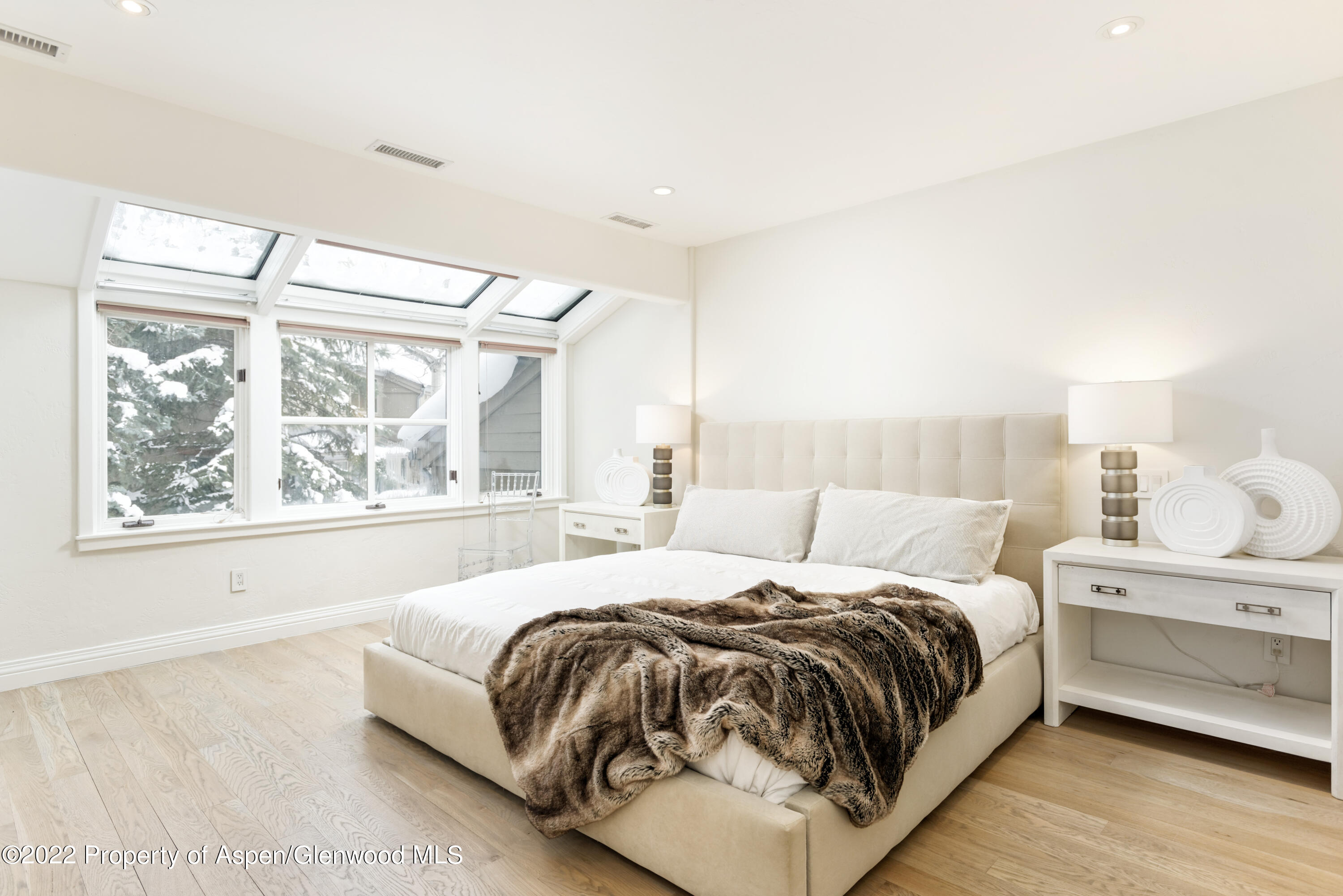 100 North 8th Street, Unit 20 Aspen, CO 81611 - Photo 9 of 18 a bed sitting in a bedroom next to a window