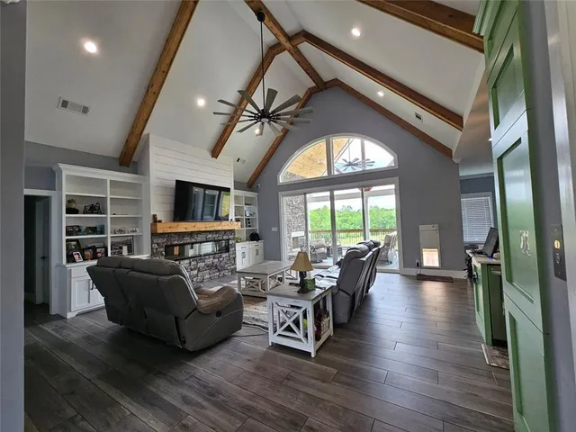 a view of a livingroom with furniture window and wooden floor