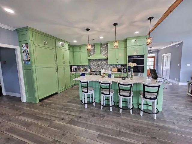 a bath tub sitting in a bathroom next to a window