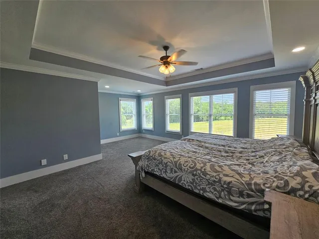a view of a kitchen with fridge and wooden floor