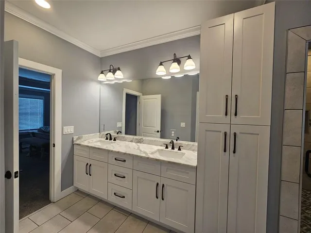 a kitchen with sink refrigerator and stove